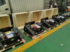 Robotic track vehicles assembled in industrial warehouse