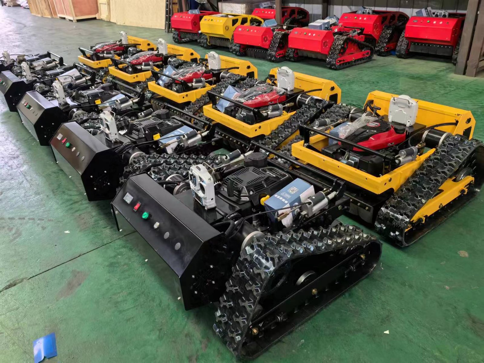 Various colored tracked robots in warehouse