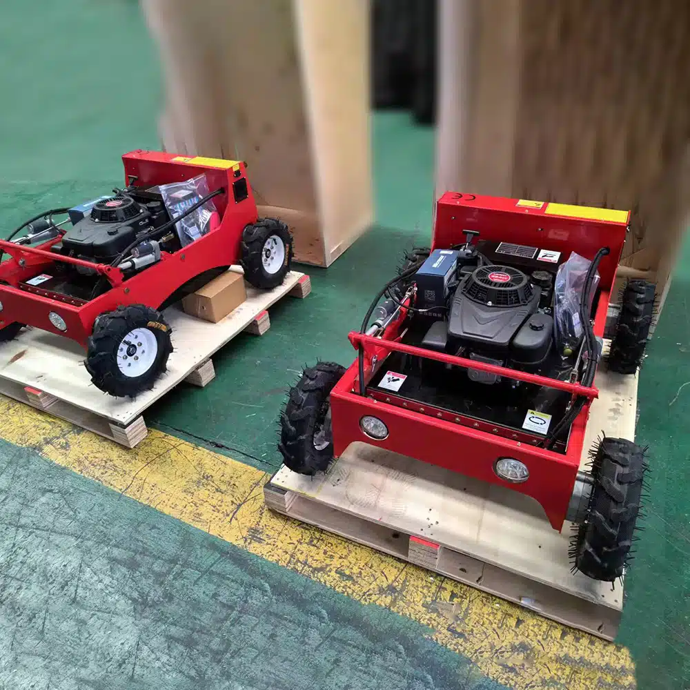 Two red utility vehicles on wooden pallets in warehouse