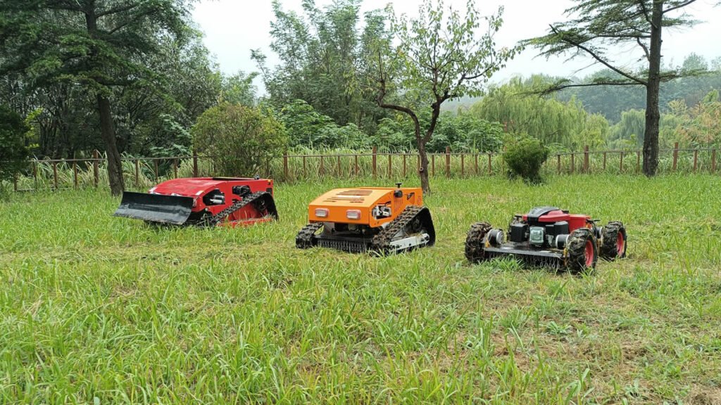 Three robotic lawn mowers on grassy field