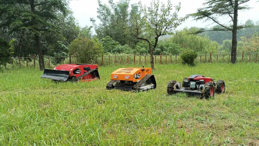 Three robotic lawn mowers on grassy field