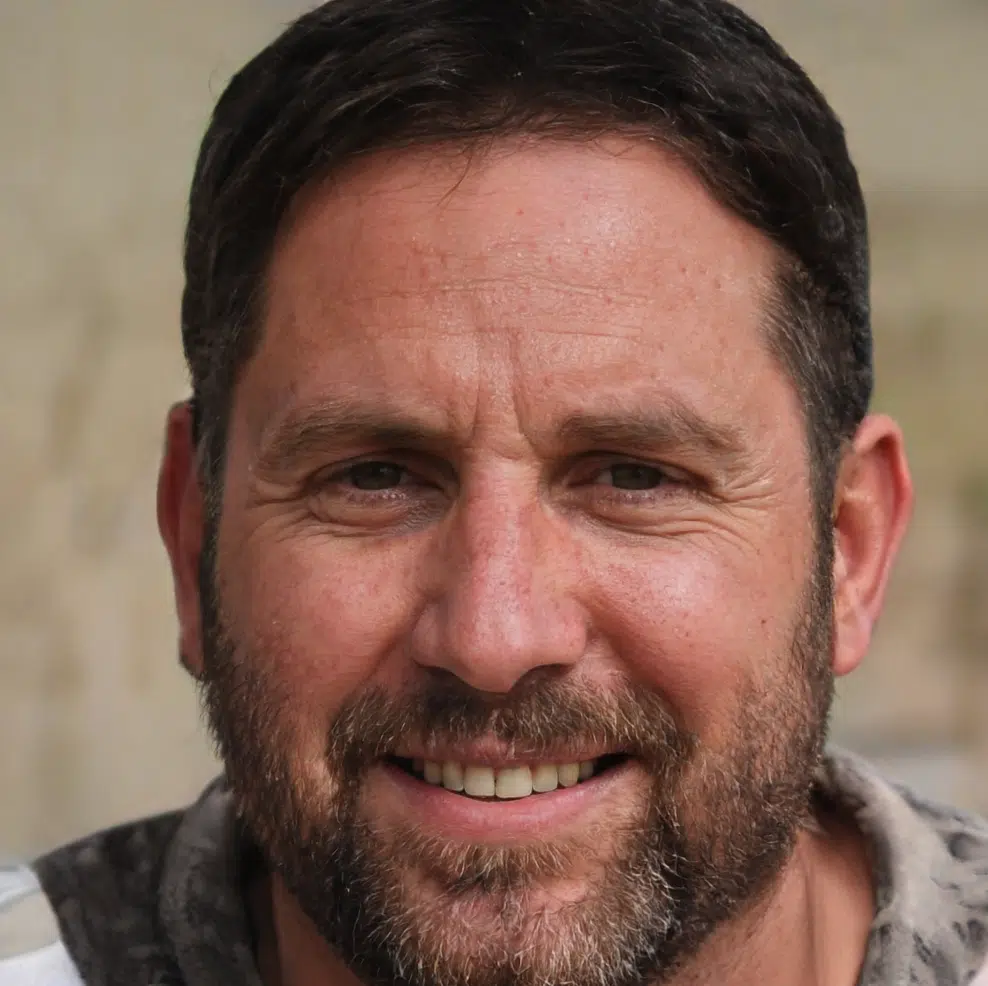 Smiling middle-aged man with beard close-up