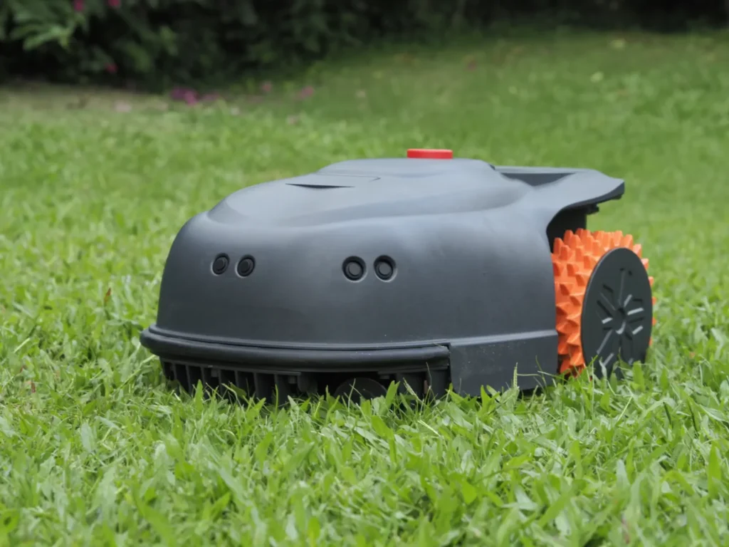 Autonomous robot lawn mower in grassy field
